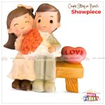 Couple Sitting On Bench Showpiece